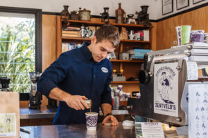 austin making coffee in our coffee house