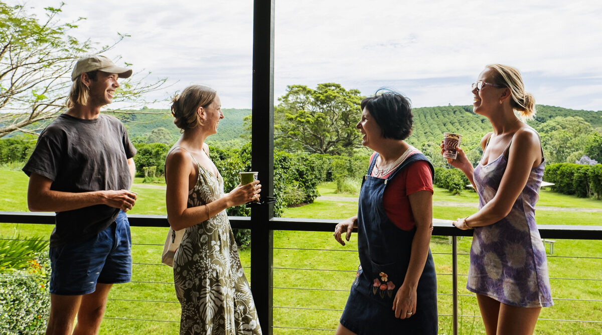 a group of people enjoying pesticide free coffee at Zentveld's Coffee Farm in the Byron Bay Hinterland