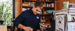 austin making coffee in our coffee house