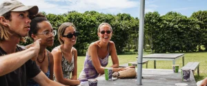 visitors enjoying their visit to a coffee farm tour